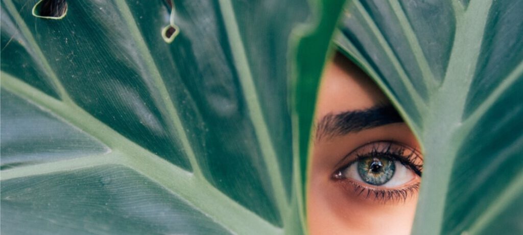 Green Leaf Covering Woman's Eye